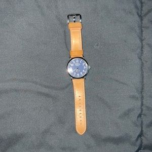 Shinola Watch with dark blue face and light brown leather strap